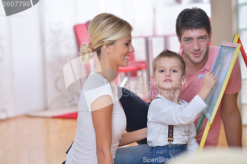 Image of family drawing on school board at home