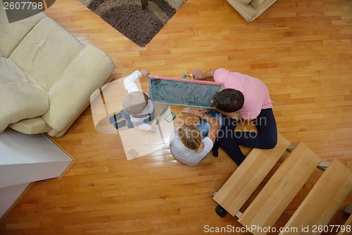 Image of family drawing on school board at home