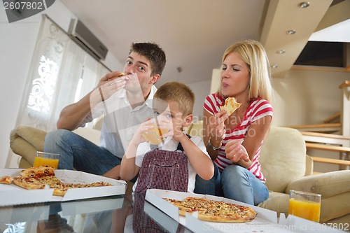 Image of family eating pizza