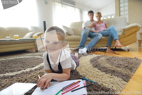 Image of family drawing on school board at home