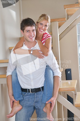 Image of Relaxed young  couple watching tv at home