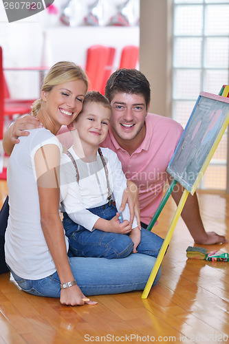 Image of family drawing on school board at home
