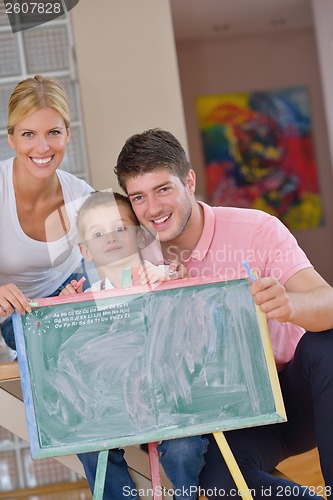 Image of family drawing on school board at home