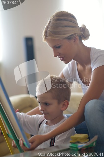 Image of family drawing on school board at home