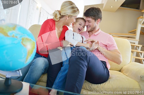 Image of family have fun with globe