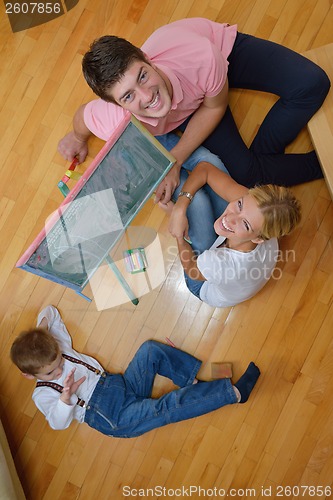 Image of family drawing on school board at home