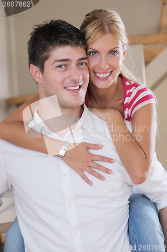 Image of Relaxed young  couple watching tv at home