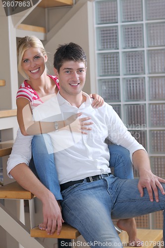 Image of Relaxed young  couple watching tv at home