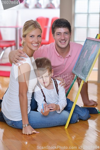 Image of family drawing on school board at home