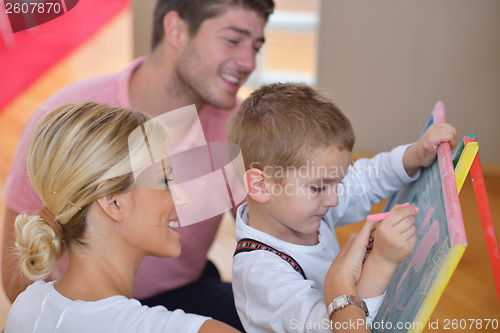 Image of family drawing on school board at home