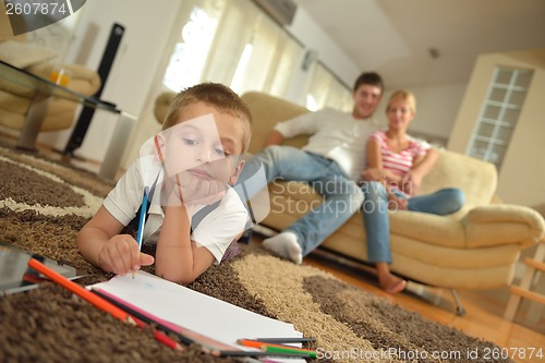 Image of family drawing on school board at home