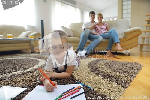 Image of family drawing on school board at home