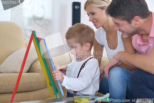 Image of family drawing on school board at home