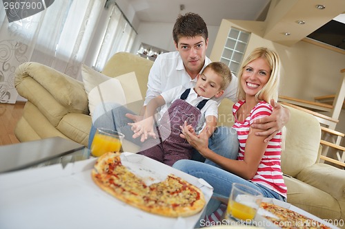 Image of family eating pizza