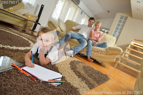 Image of family drawing on school board at home