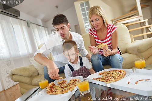 Image of family eating pizza