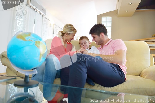 Image of family have fun with globe