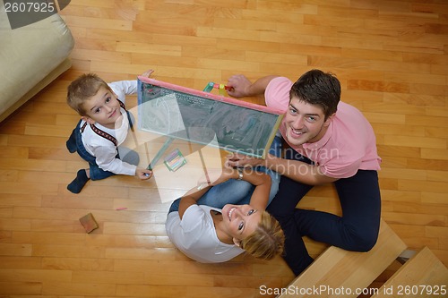 Image of family drawing on school board at home