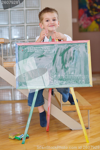 Image of family drawing on school board at home