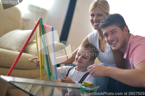 Image of family drawing on school board at home