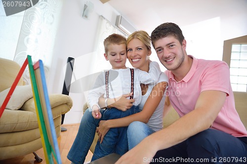 Image of family drawing on school board at home