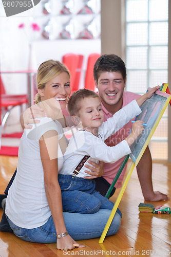 Image of family drawing on school board at home