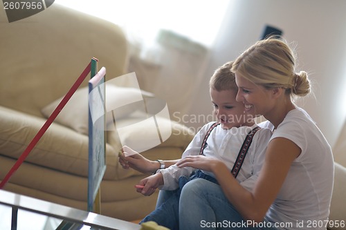 Image of family drawing on school board at home