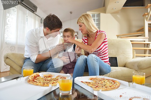 Image of family eating pizza