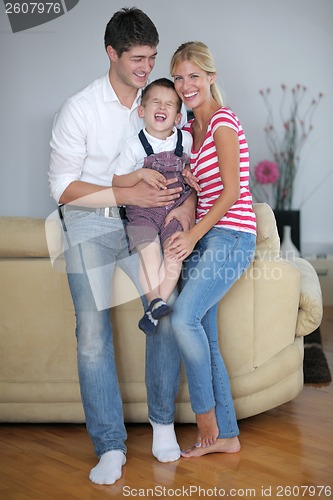 Image of family at home using tablet computer