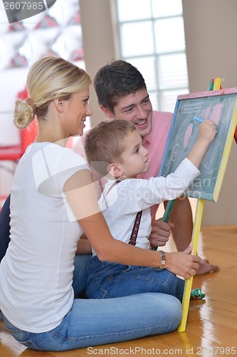 Image of family drawing on school board at home