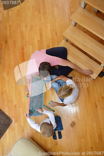 Image of family drawing on school board at home