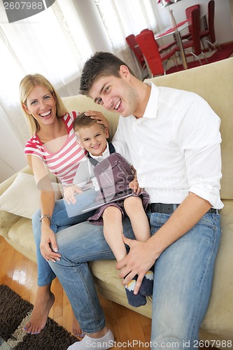 Image of family at home using tablet computer