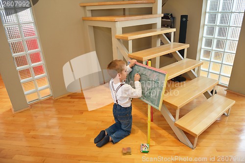 Image of family drawing on school board at home