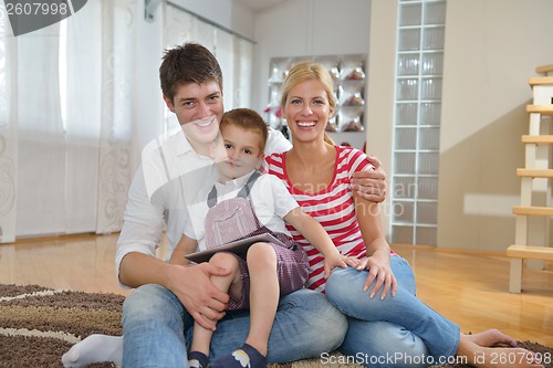 Image of family at home using tablet computer