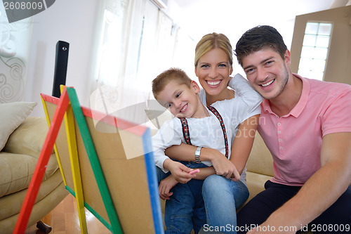 Image of family drawing on school board at home
