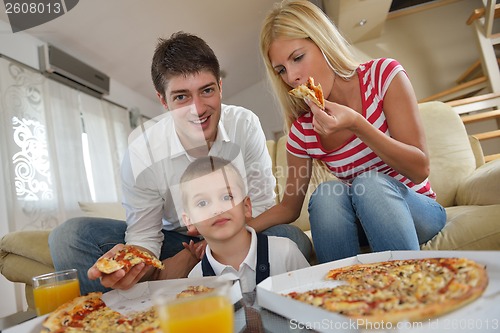 Image of family eating pizza