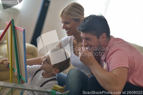 Image of family drawing on school board at home