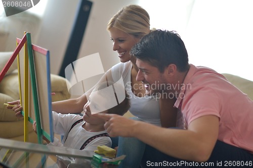 Image of family drawing on school board at home