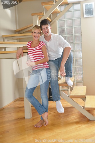 Image of Relaxed young  couple watching tv at home