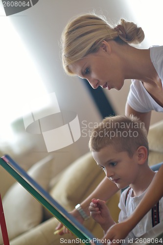 Image of family drawing on school board at home