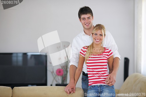 Image of Relaxed young  couple watching tv at home