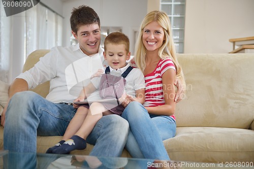 Image of family at home using tablet computer