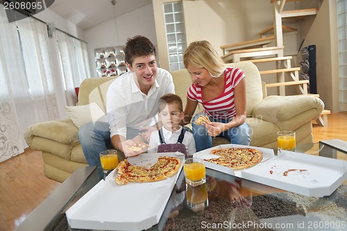 Image of family eating pizza