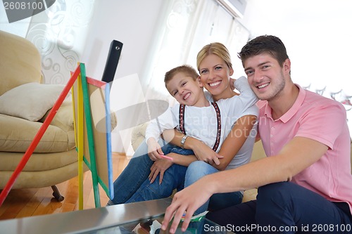 Image of family drawing on school board at home