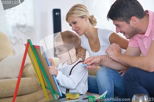 Image of family drawing on school board at home