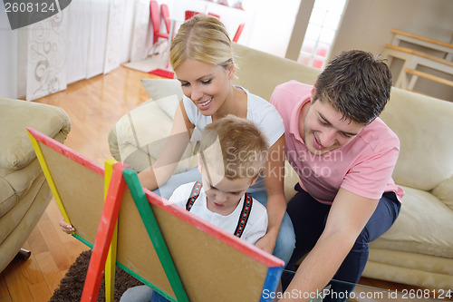 Image of family drawing on school board at home