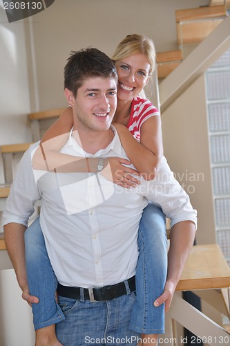 Image of Relaxed young  couple watching tv at home