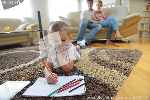 Image of family drawing on school board at home