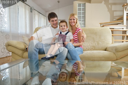 Image of family at home using tablet computer