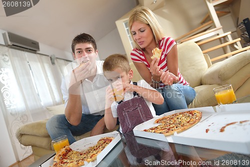 Image of family eating pizza